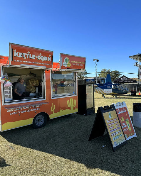The Cactus Corn kettle corn trailer set up at an outdoor Arizona event