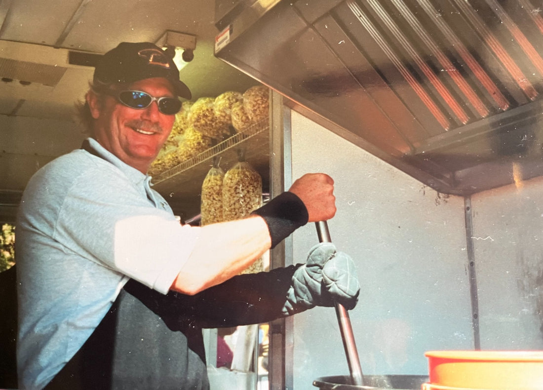Mike Levandowski stirring kettle corn popped in coconut oil at the Cactus Corn kiosk
