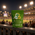 White Cheddar Jalapeño popcorn bag from Cactus Corn on a stadium railing during a night ballgame